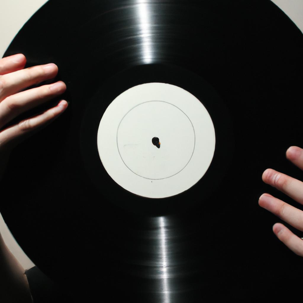 Person holding a vinyl record