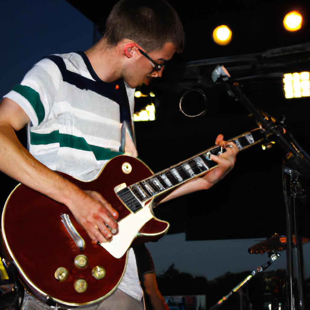 Sam Johnson playing guitar onstage